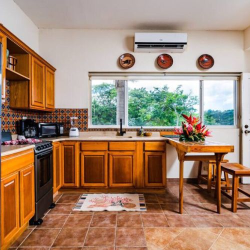 The kitchen is fully equipped to cook family meals and has AC to keep everyone cool!