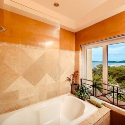 Relax in this tub while you enjoy a view of Tamarindo Bay