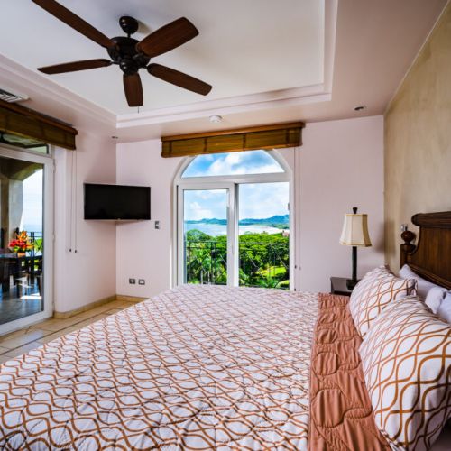 Master Bedroom with king-size bed and ocean view
