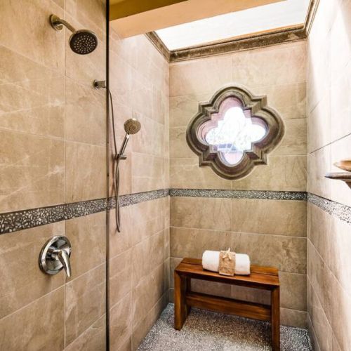 This property has a beautiful spacious shower.