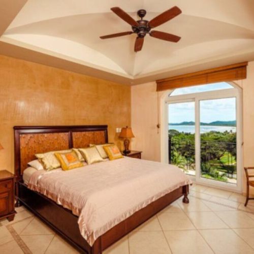 The master bedroom is a furnished with a comfortable king bed.