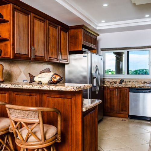 The condominium has a full kitchen with nice granite counters