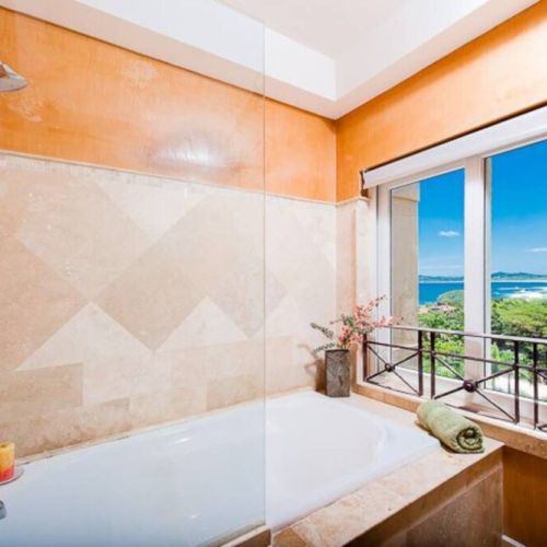 Relax in this tub while you enjoy a view of Tamarindo Bay