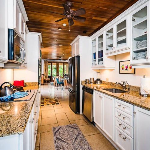 Enjoy the beautiful granite counters and all the needed equipment in this modern-style kitchen.